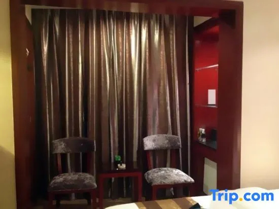 Yi Long Hotel - Chambres