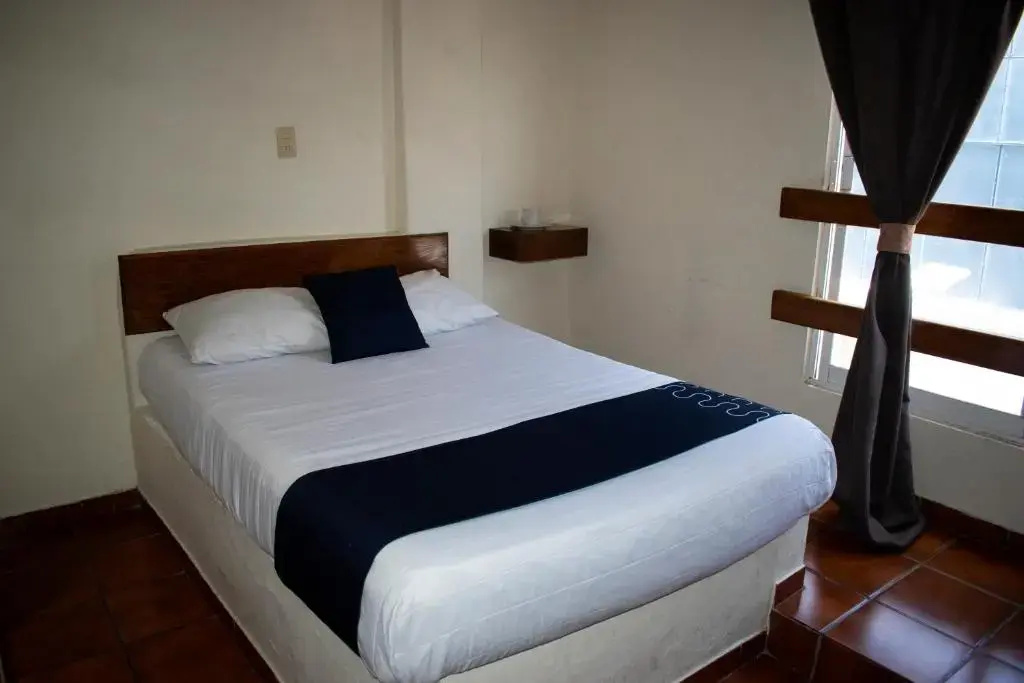 Capital O Hotel Casa Blanca - Chambres