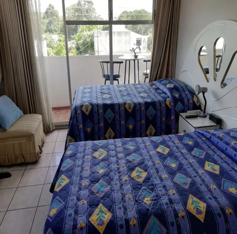 Mariana's Petit Hotel - Chambres