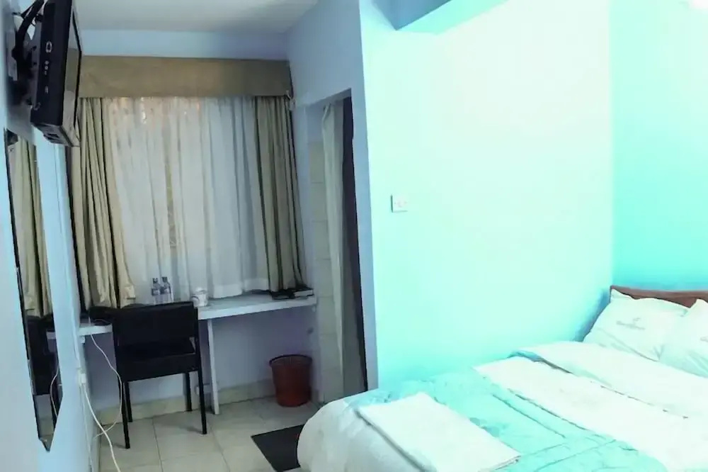 The Coconut Grill Hotel - Chambres