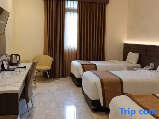 Multazam Syariah Hotel - Chambres