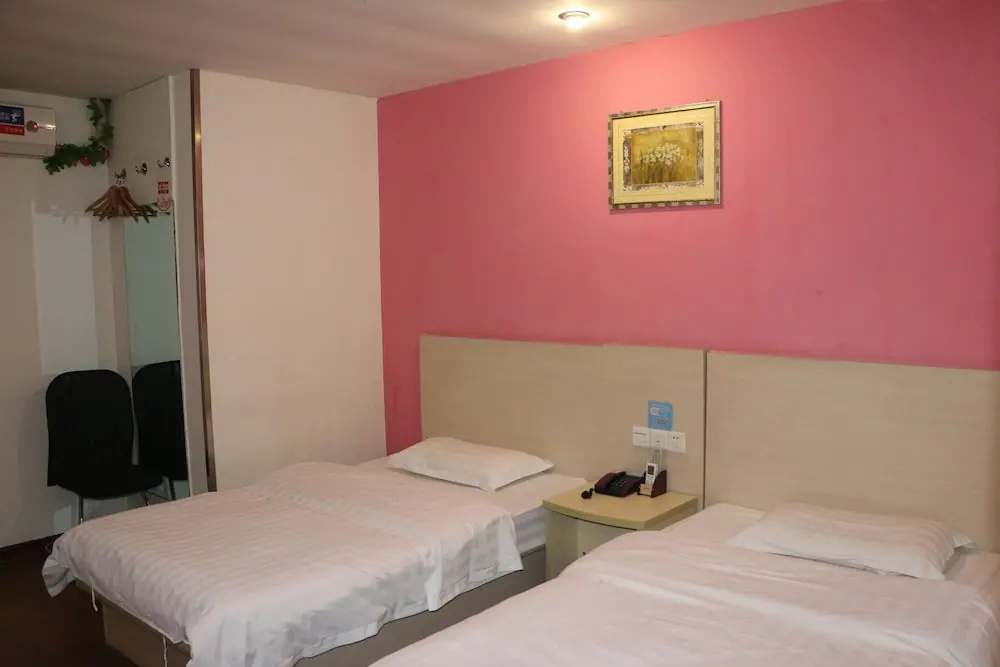 Yixin Business Hotel - Chambres