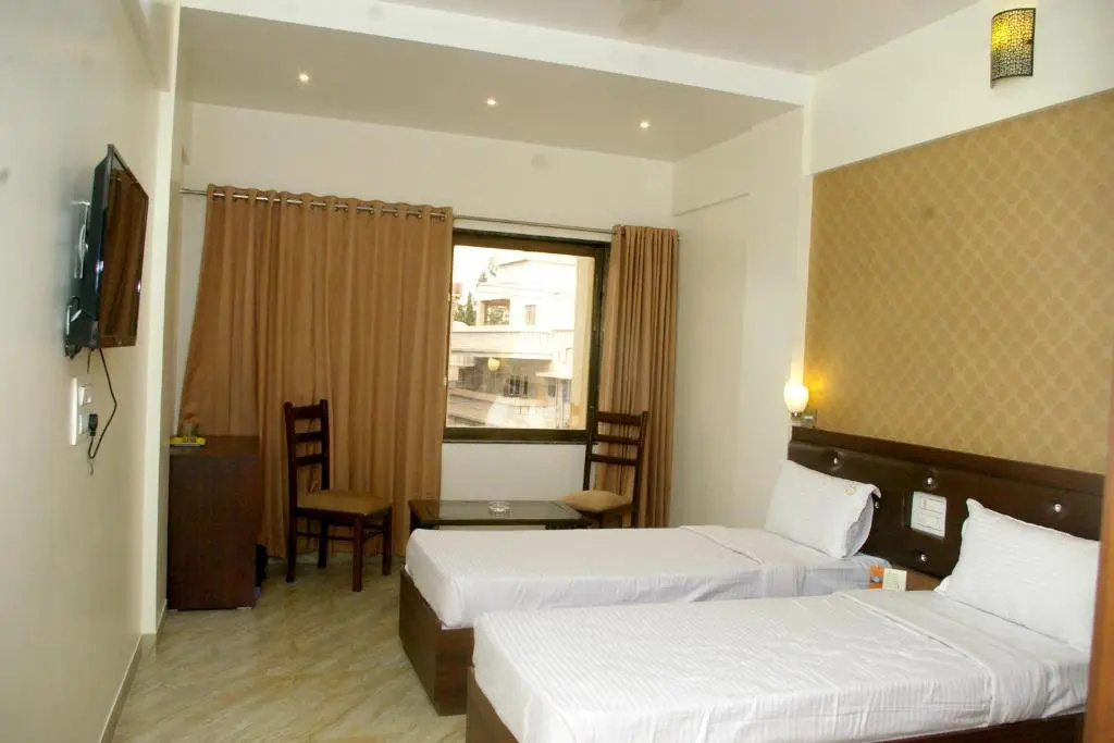 Hotel Gulmohar Pride - Chambres