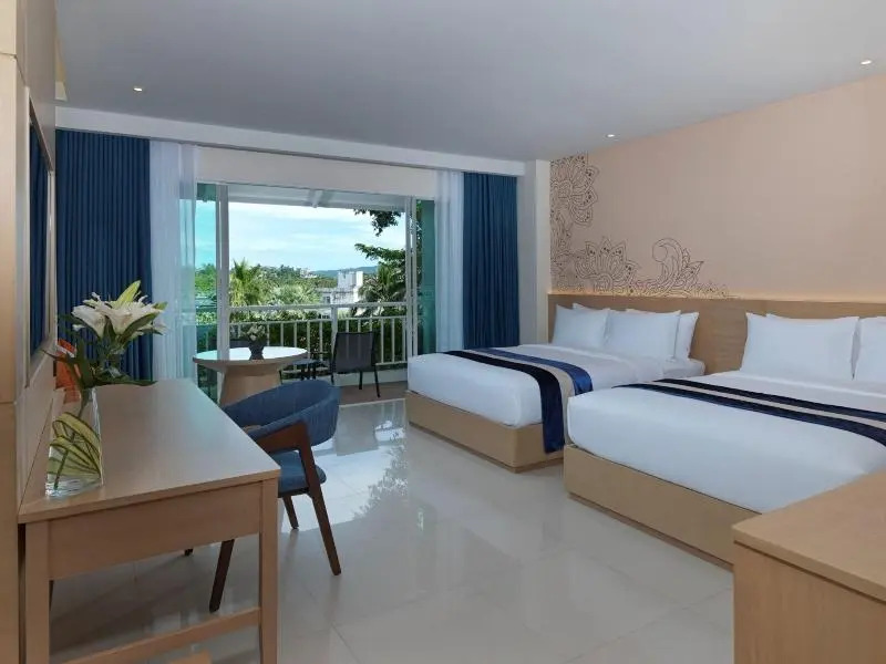 Двухместный номер Grand Deluxe с балконом двуспальная кровать в Chanalai Flora Resort, Kata Beach