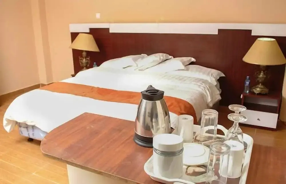 The Coconut Grill Hotel - Chambres