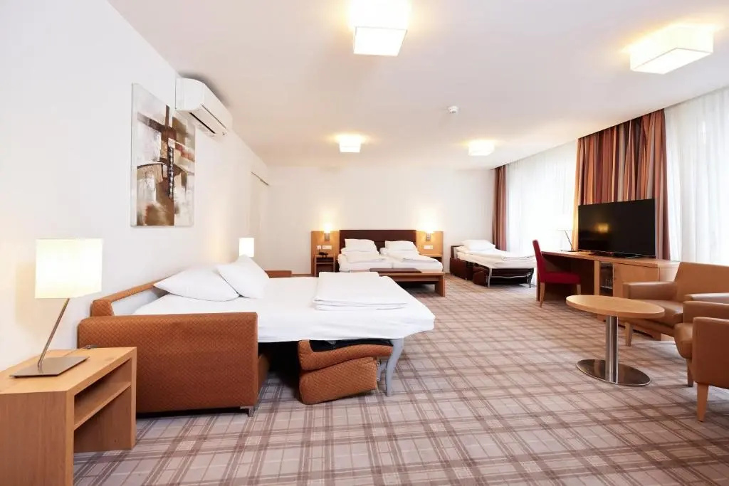 Central City Hotel Rochat - Chambres