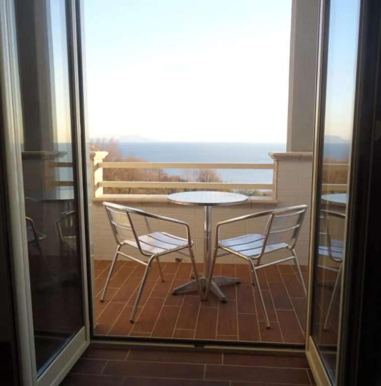 Standard Quadruple room with garden view