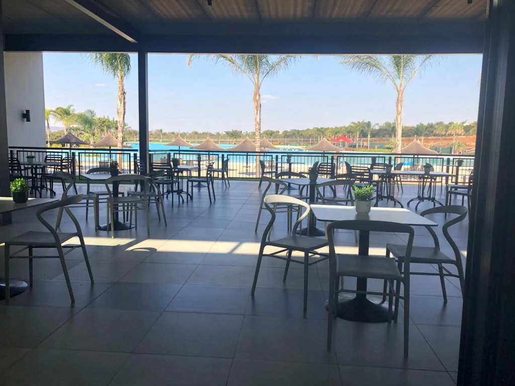 A Coastal/island experience at a Large 2 bed apartment at a Crystal Lagoon Estate.