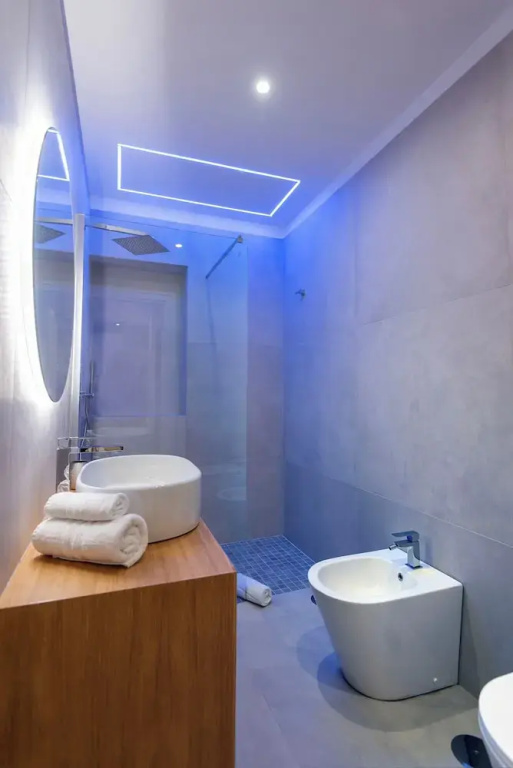 Deluxe Quadruple room with balcony and with city view