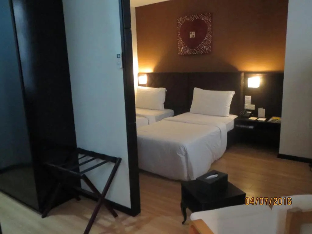Tat Place Hotel - Chambres