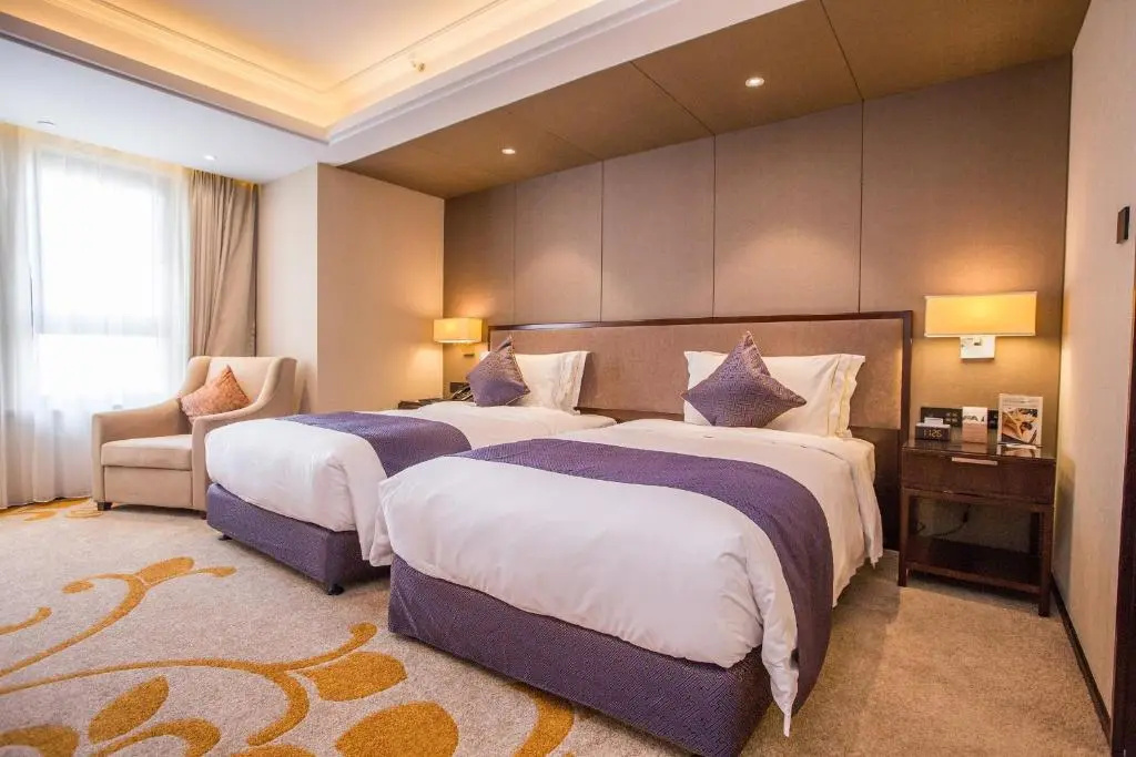 Sky World Hotel Qingdao - Chambres