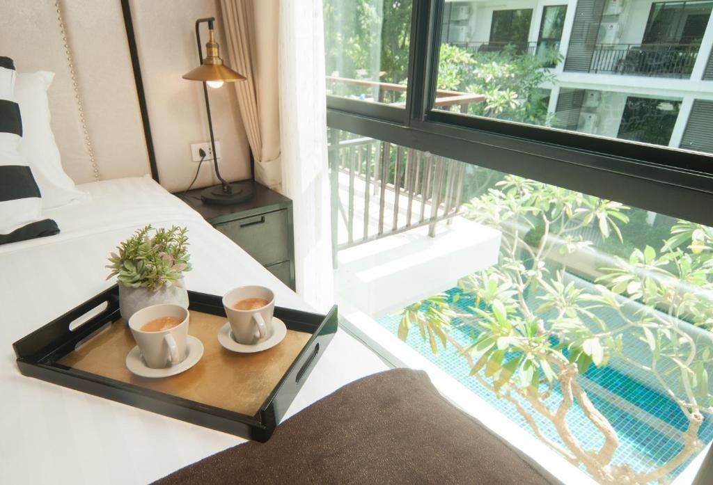 Люкс c 1 комнатой с видом на бассейн в The Title KR Beach Condotel Rawai Phuket