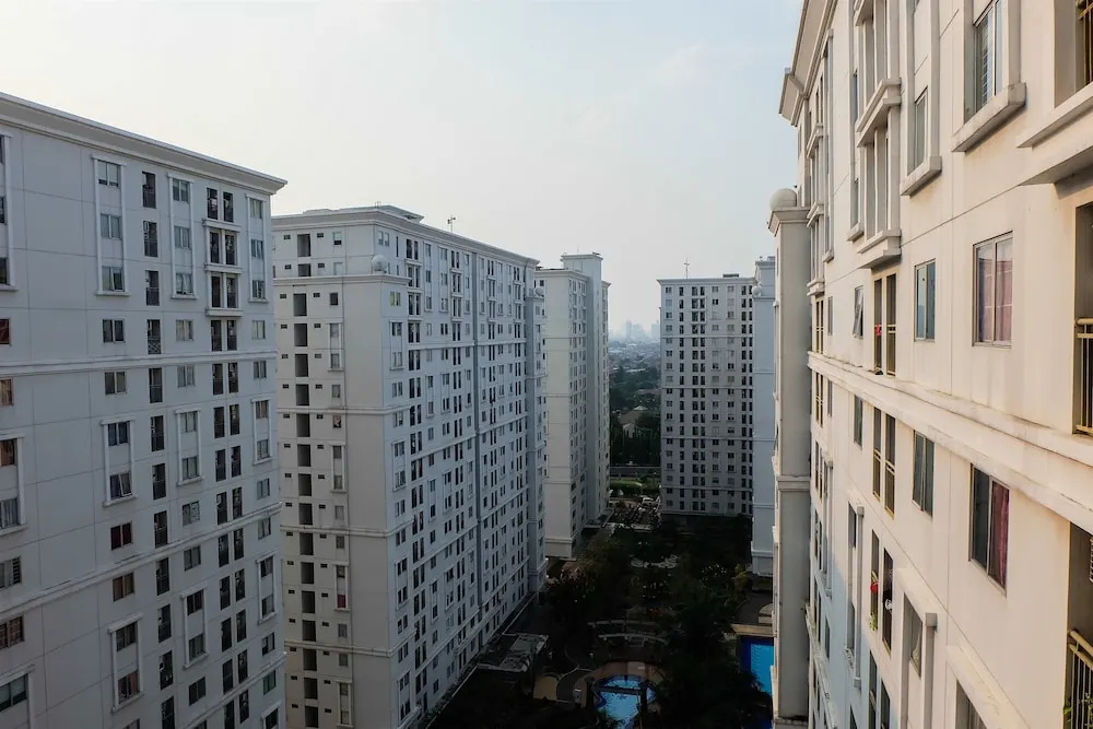 Monochrome Style 2 Bedrooms at Kalibata City Apartment By Travelio