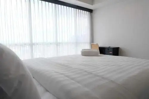 1BR Apartment with Sofa Bed at The H Residence By Travelio