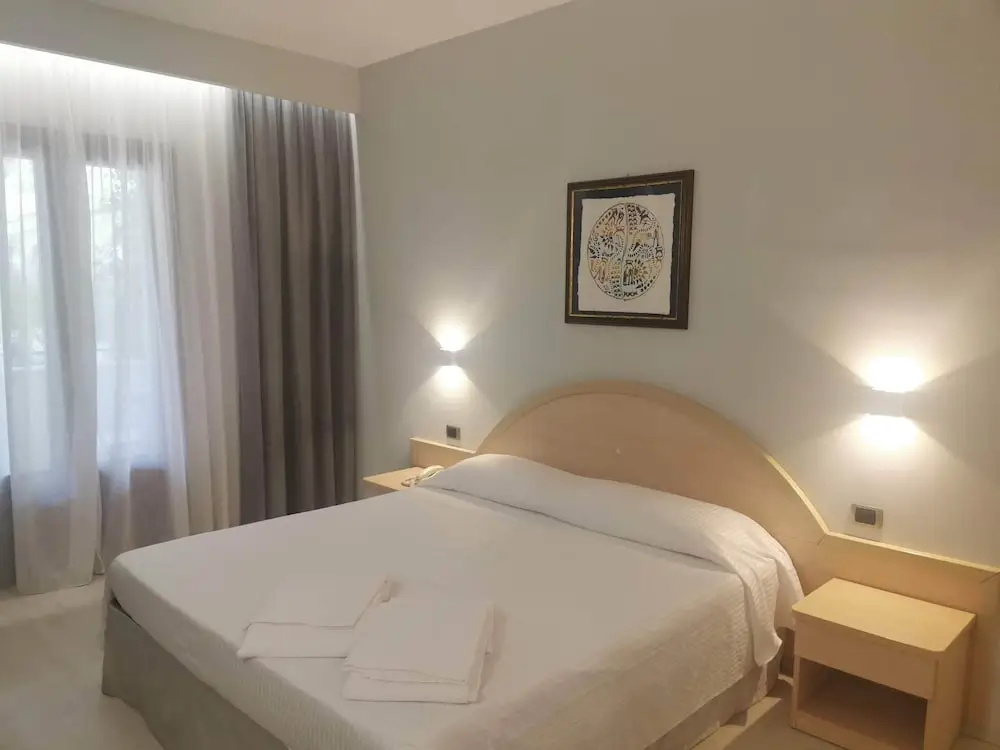 Standard Quadruple room with balcony and with garden view