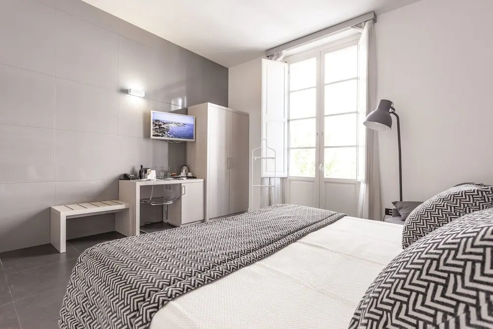 Superior Quadruple room with balcony and with city view