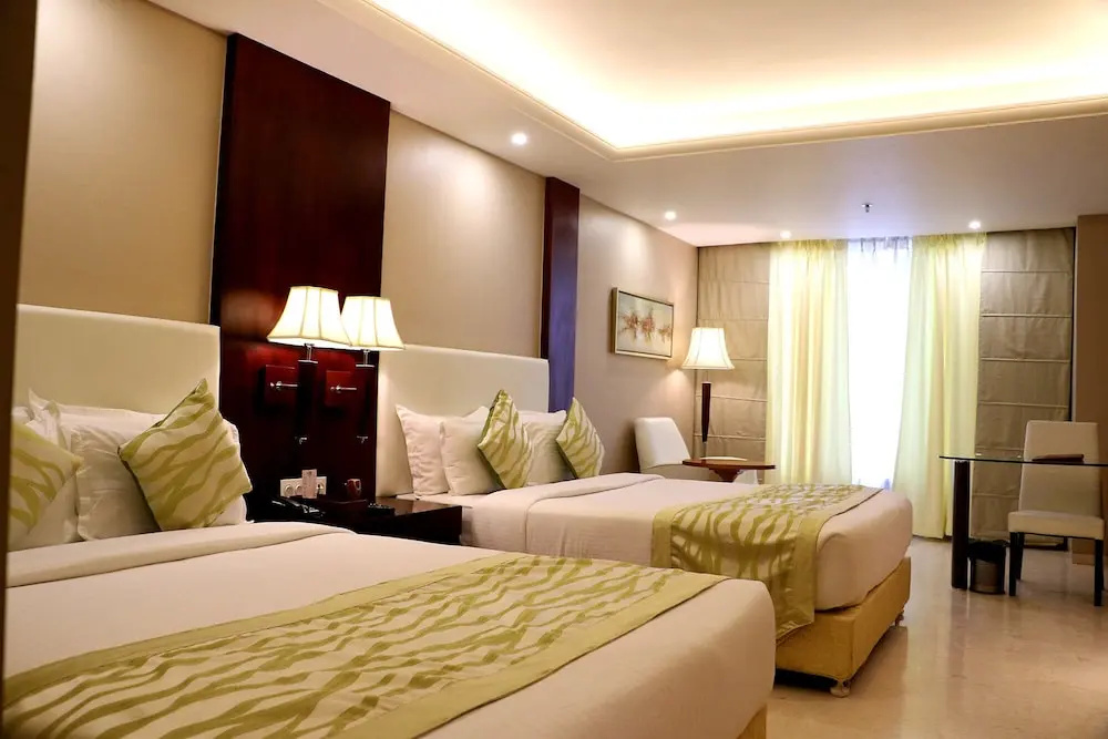 Trinity Grand - Chambres
