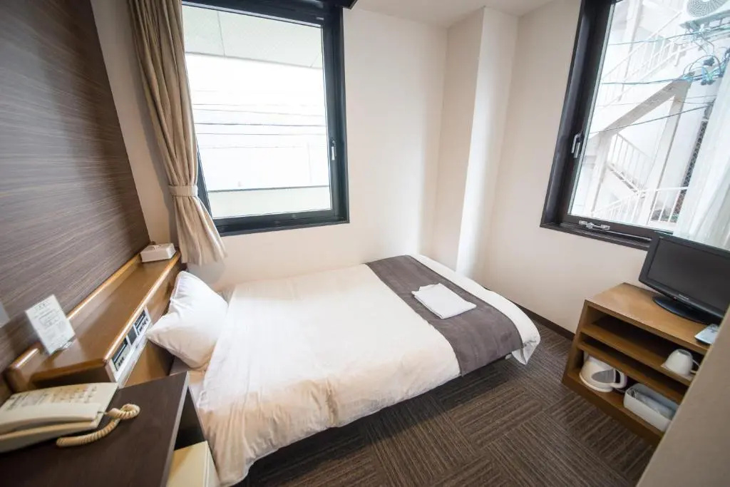 Sai Hotel - Chambres