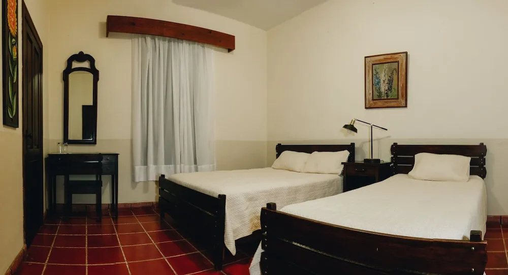 Standard Triple room with garden view