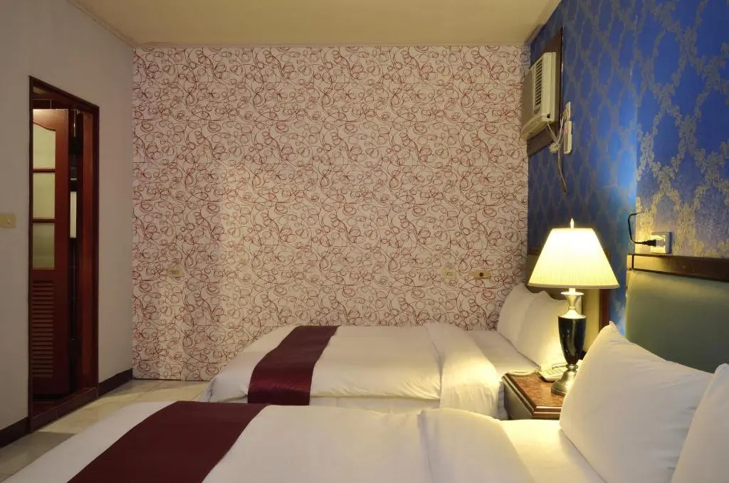 Jiuning Business Hotel - Chambres