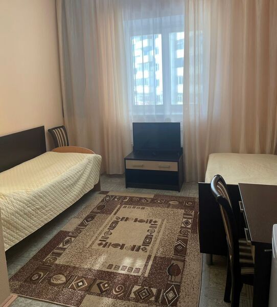 Кровать в общем номере в Фотон