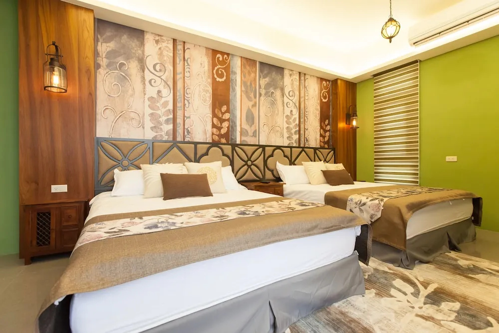 Standard Quadruple room with balcony and with garden view