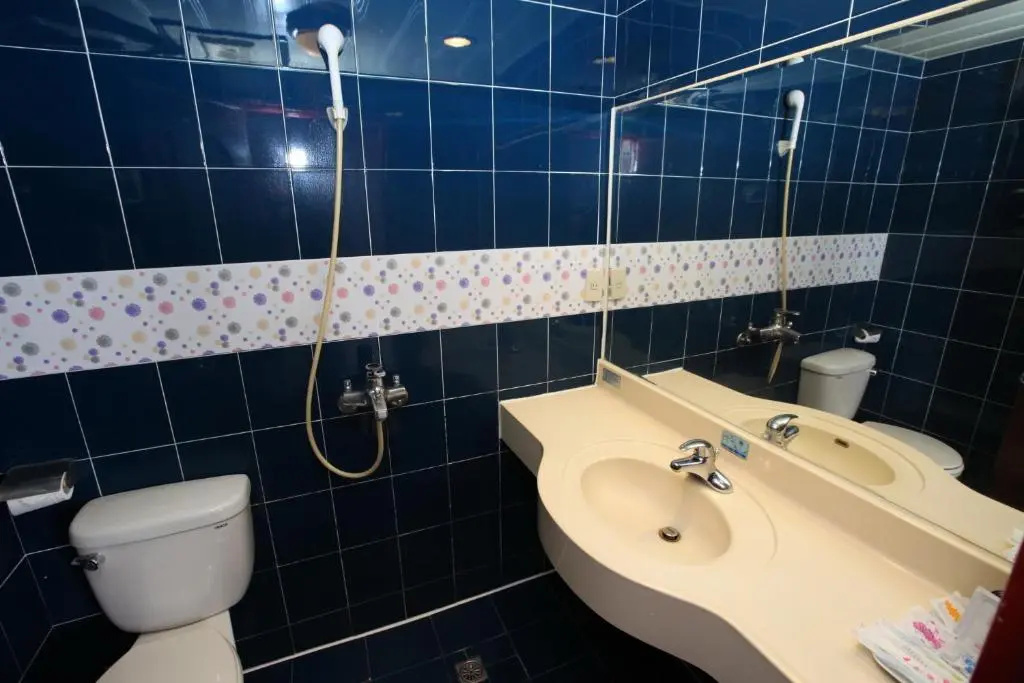 Jiuning Business Hotel - Chambres