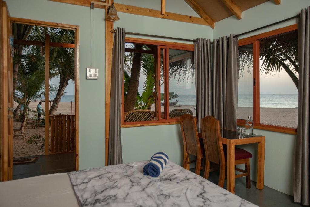 Бунгало рядом с пляжем в Goa Cottages Agonda