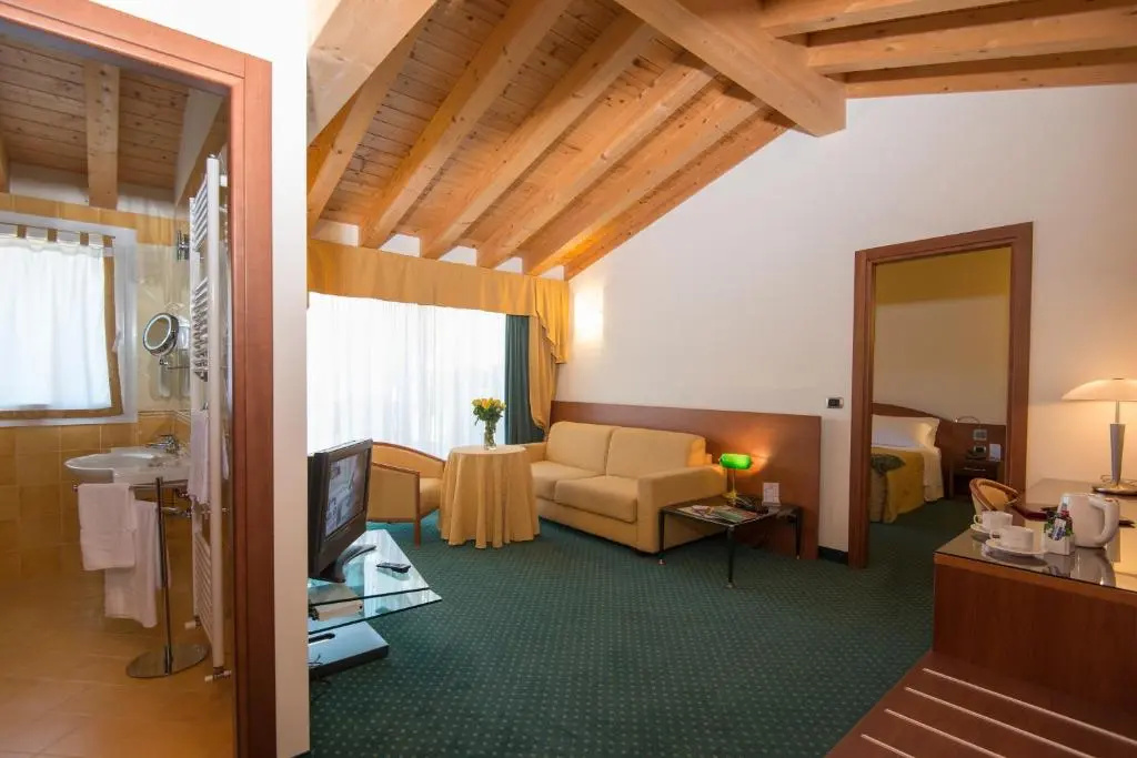 Double Suite with balcony and with pool view full double bed