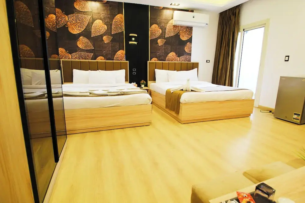 Deluxe Quadruple room with balcony and with garden view
