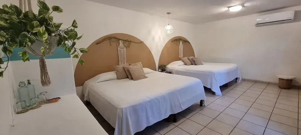 Standard Quadruple room with garden view