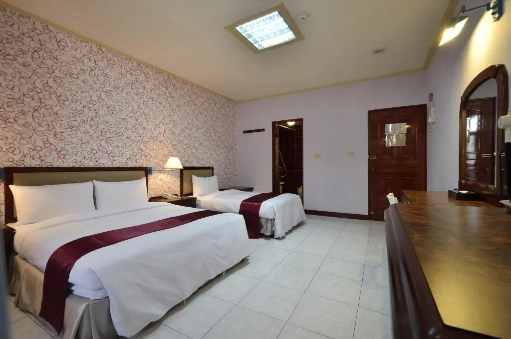 Jiuning Business Hotel - Chambres