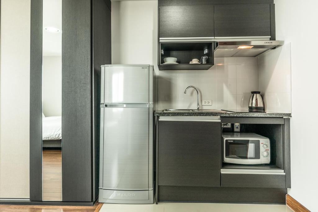 Двухместная студия 2 отдельные кровати в Winner Sriracha Service Apartment