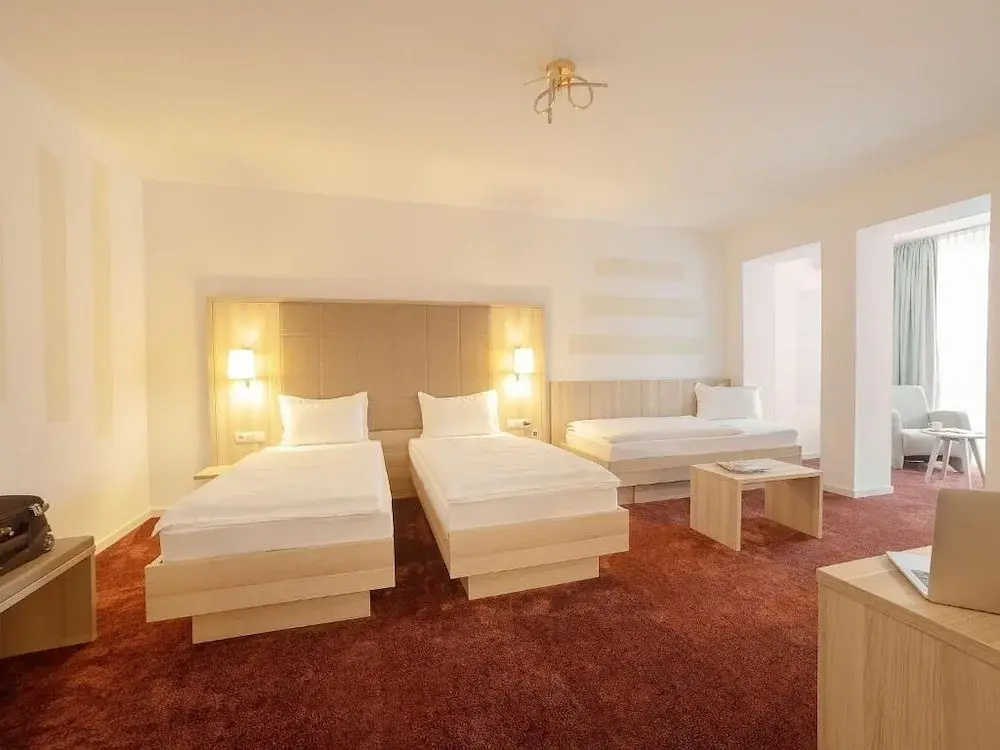 Standard Triple room with garden view