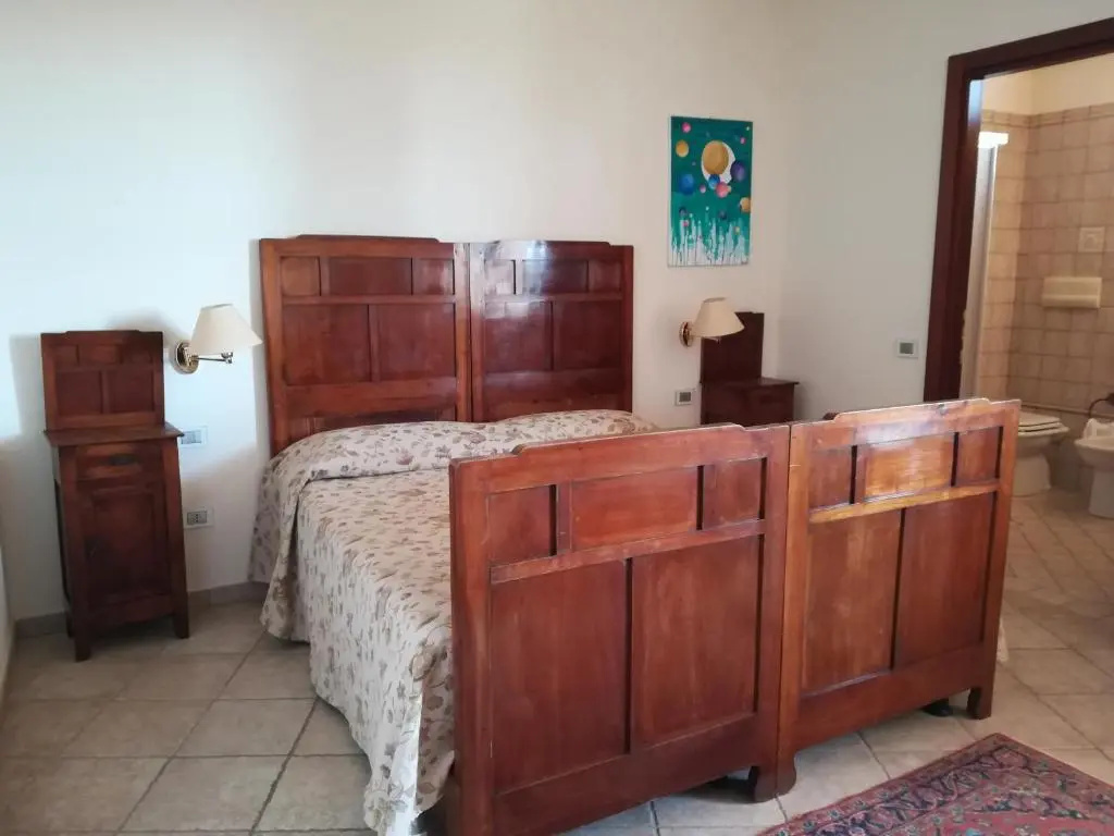 Standard Quadruple room with garden view