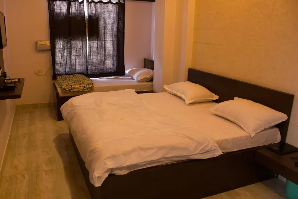 Hotel Holiday Home - Chambres