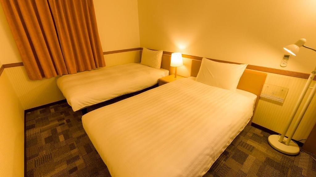 Двухместный номер Standard 2 отдельные кровати в Toyoko Inn Okinawa Naha Omoromachi Ekimae