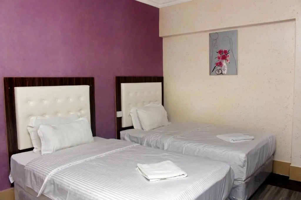 Delmon Hotel Apartments - Chambres