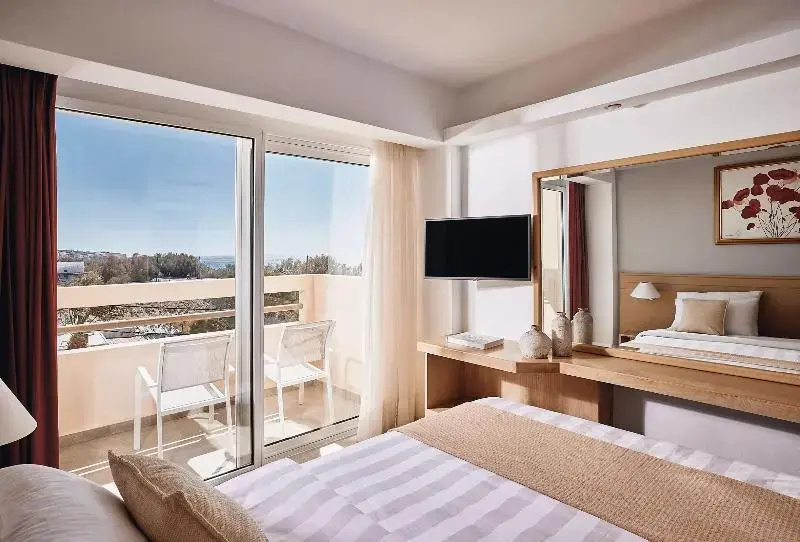Standard Triple room with balcony and with partial sea view