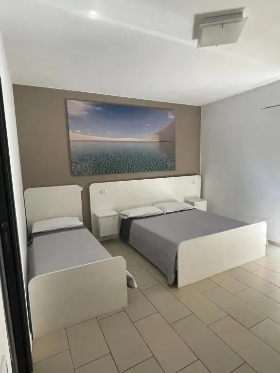 Standard Triple room with garden view