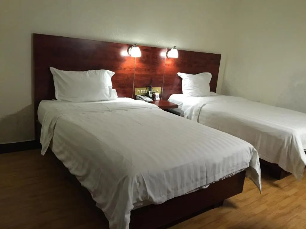 Guang Dong Hotel - Chambres