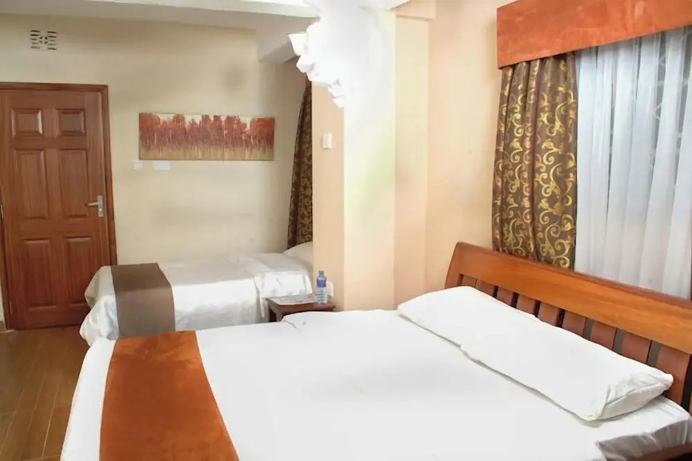 The Coconut Grill Hotel - Chambres