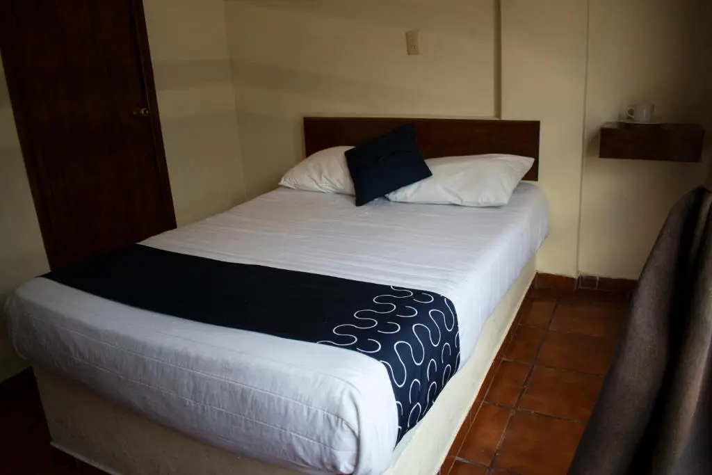 Capital O Hotel Casa Blanca - Chambres