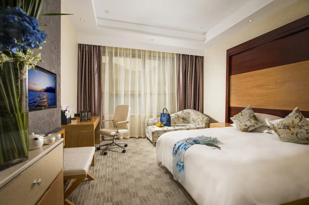 Huachen International Hotel - Chambres