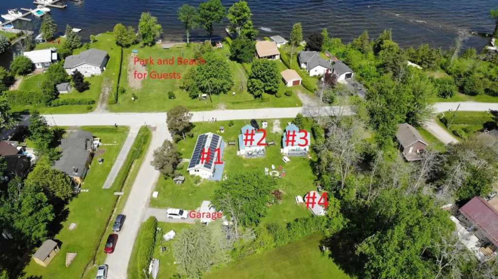 Family Relaxation Place for 2-15 People - 4 Lakeview Cottages with Real Sandy Swimming Beach, Dock, Boats, Firepits, Recreation Room