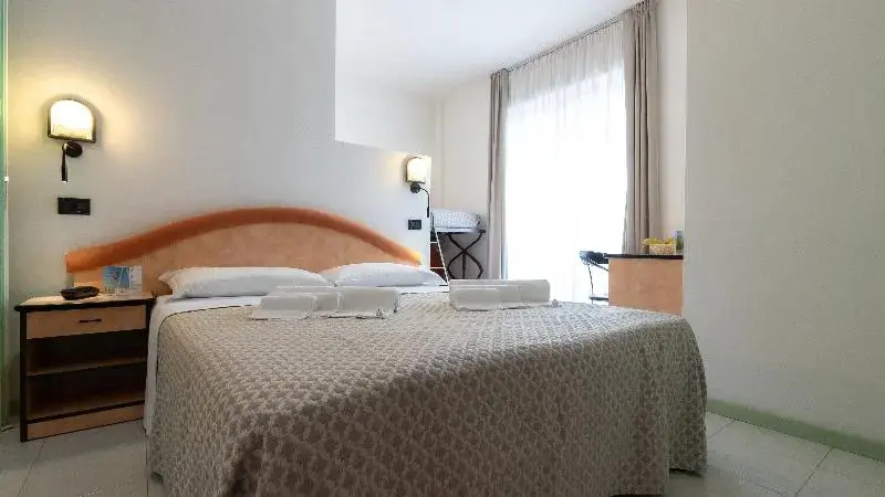 Standard Quadruple room with balcony and with partial ocean view