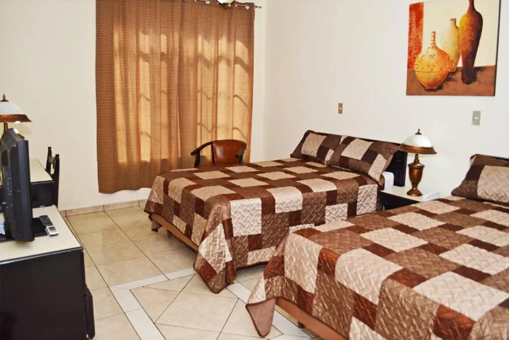 Hotel Tropico Inn - Chambres