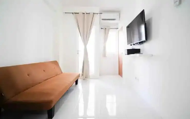 Tidy and Cozy Living 2BR at Puncak Dharmahusada Apartment By Travelio