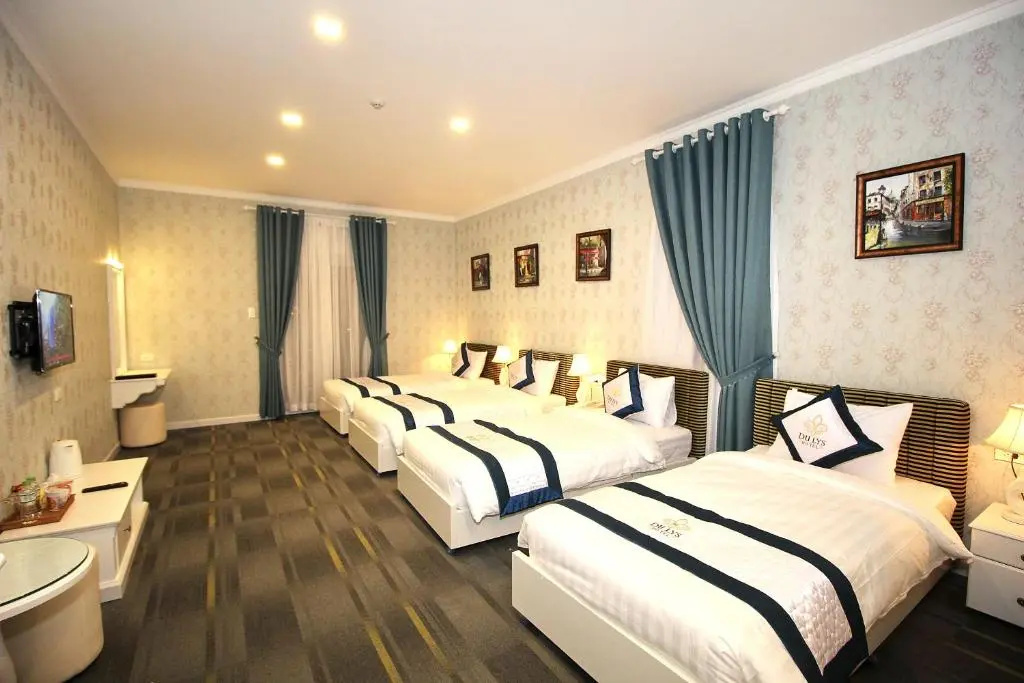 Deluxe Quadruple room with balcony