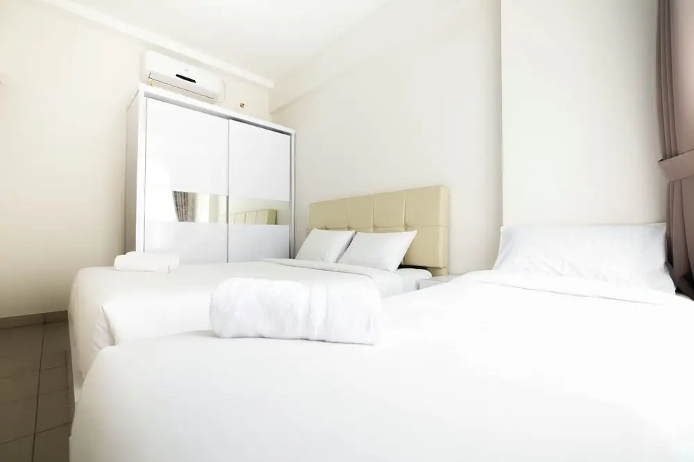 Elegant and Spacious 1BR Saveria Apartment near ICE BSD By Travelio